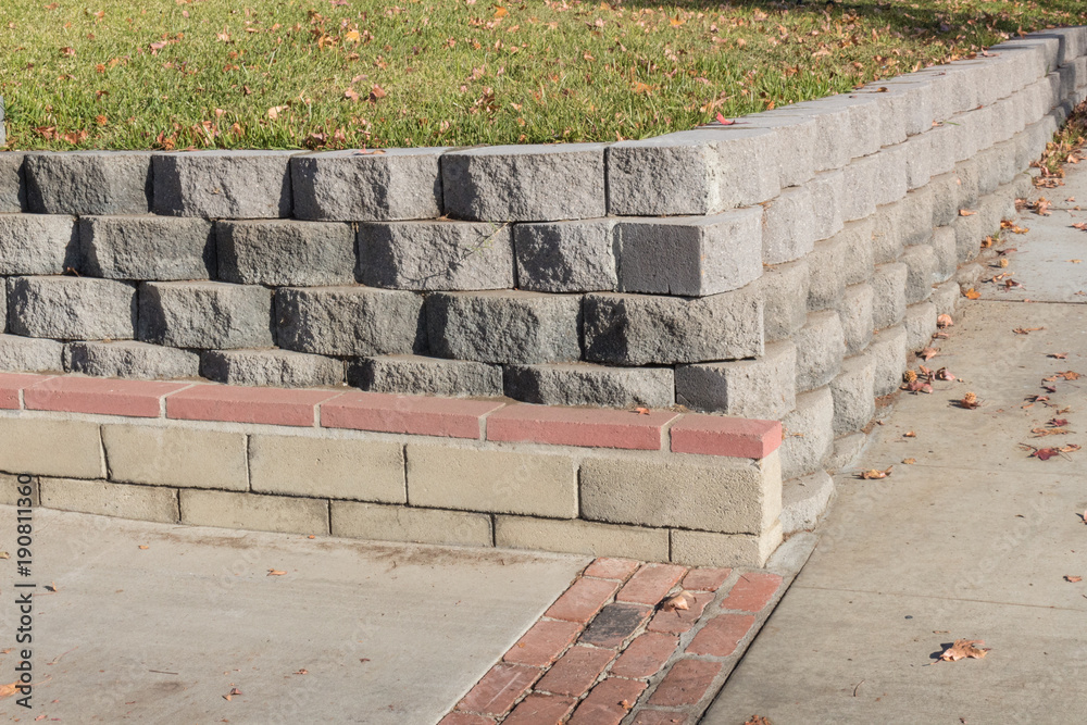 How do you construct a retaining wall?